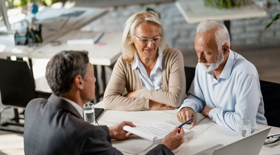 Older couple talking to advisor
